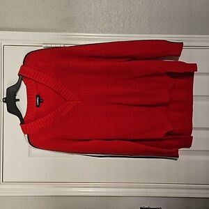 Red sweater with stripes on arms. Oversize feel